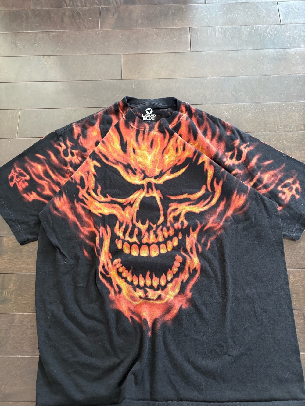 Liquid Blue Black Graphic Tee with Orange and Red Flaming Skull